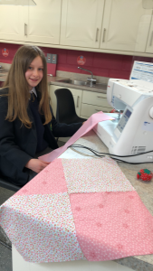 Student with a sewing machine