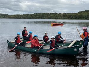 Group of students and staff kayaking. 
