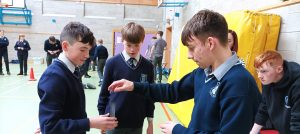 Students working together in a gym.