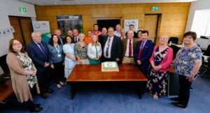 Group of people with a cake.