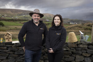 Image of Donegal Bees Co-Owners standing side by side.