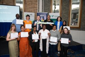 Group of people with certificates. 