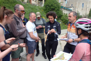 Group of people discussing a map.